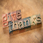 Give thanks word abstract in vintage letterpress wood