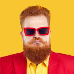 Man with red beard and glasses